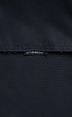 Двубортный oversize плащ с необработанными краями. Асимметричная отлетная кокетка, отложной воротник и широкий пояс из основного материала. На подкладке.